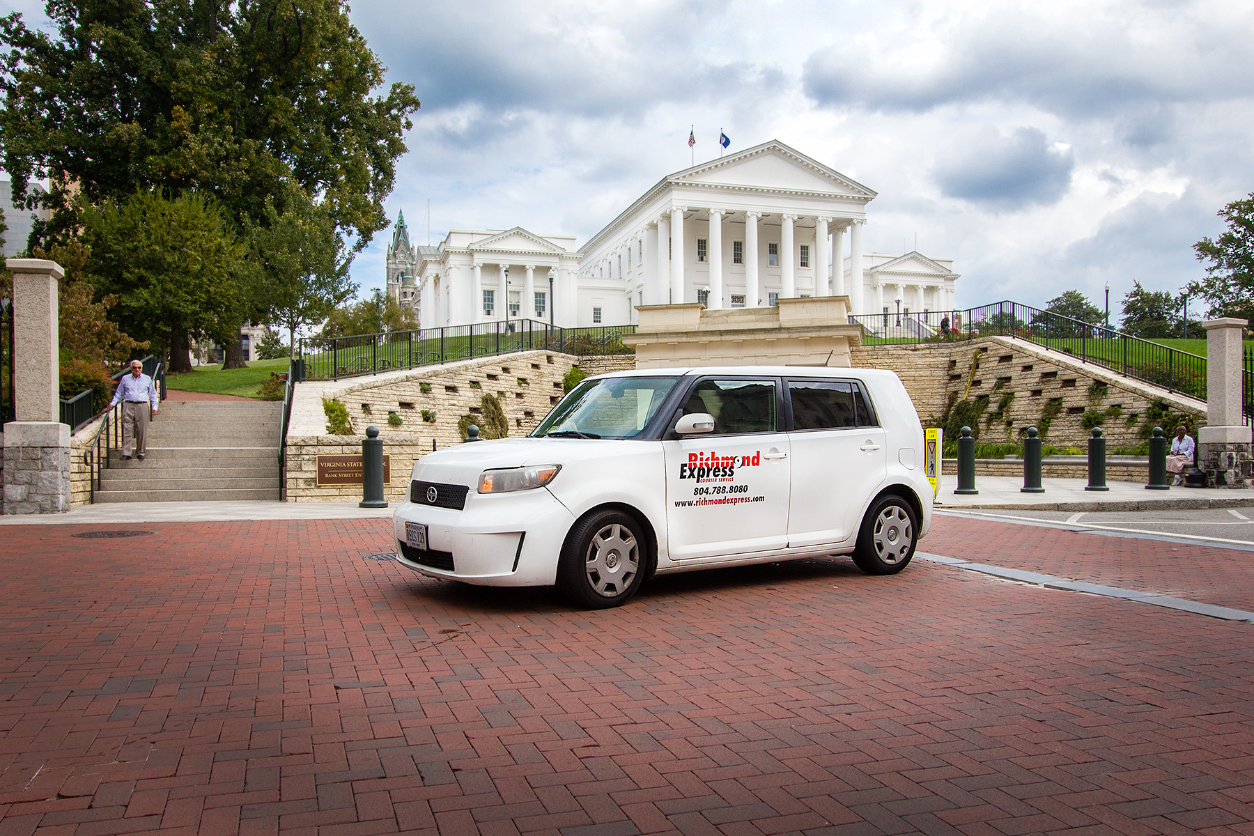 A Richmond Express van parked in front of the Virginia state capitol building